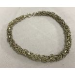 An attractive un-hallmarked white metal chain & rope link bracelet.