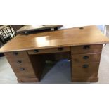 A modern oak effect pedestal desk with 3 drawers and cupboard.