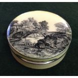 A silver and guilloche hinged lidded trinket pot with hand painted scene under glass to the lid.