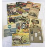 A collection of vintage Brooke Bond and Lyons tea card albums with cards.