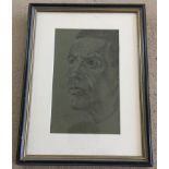 A framed and glazed pastel of a gentleman's profile.
