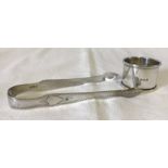 An antique silver pair of engraved sugar tongs.
