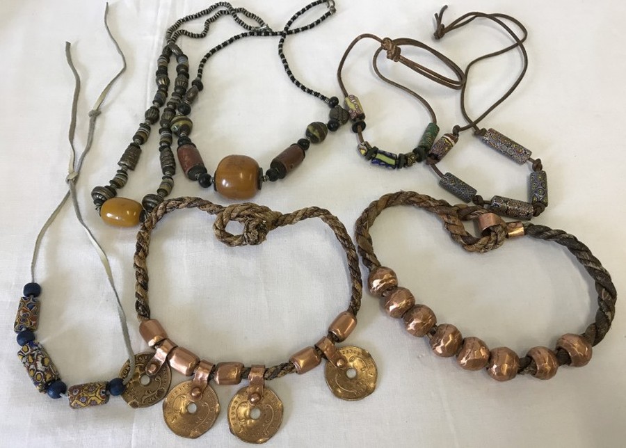 6 African copper and ethnic style bead necklaces.