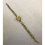 Ladies 9ct gold Accurist watch with diamond set in dial.