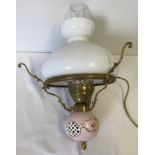 A vintage ceiling hanging light with glass chimney and shade.