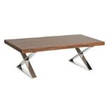 A modern chrome X base coffee table with veneer wood top.