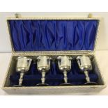 A cased set of 4 pewter goblets.