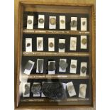 A cased collection of 23 rocks & fossils.