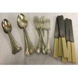 A quantity of silver plated cutlery with floral design to handles.