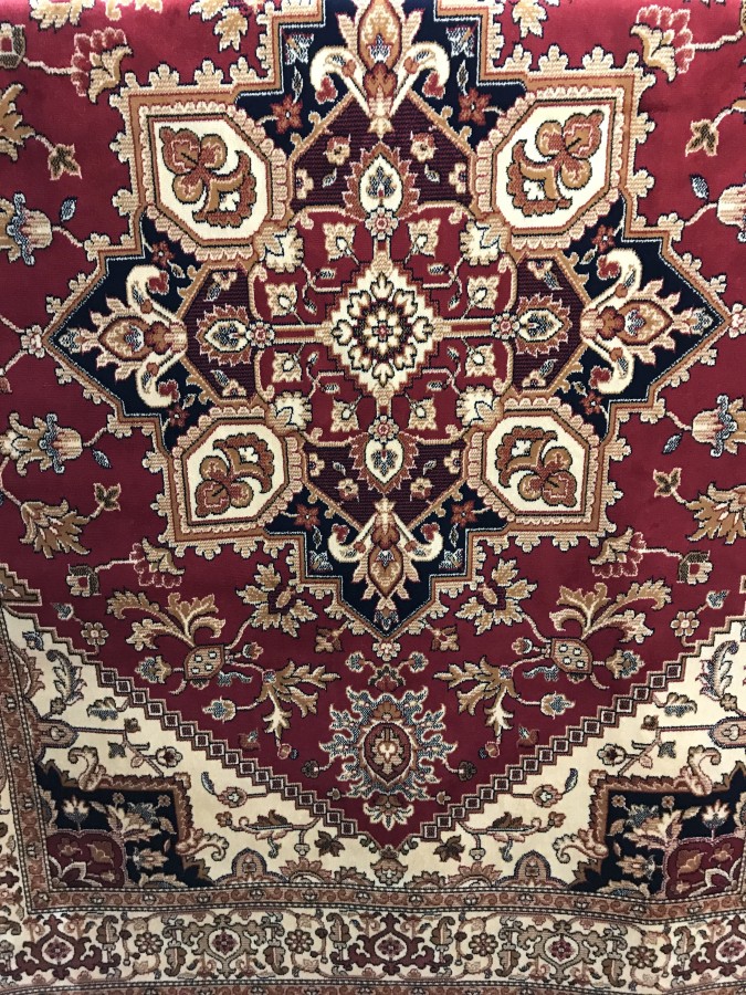 A new Heriz rug with red background.