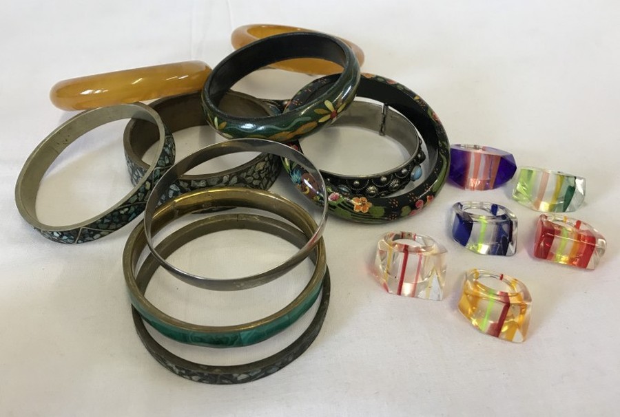 A collection of bangles including one decorated with malachite.