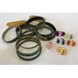 A collection of bangles including one decorated with malachite.