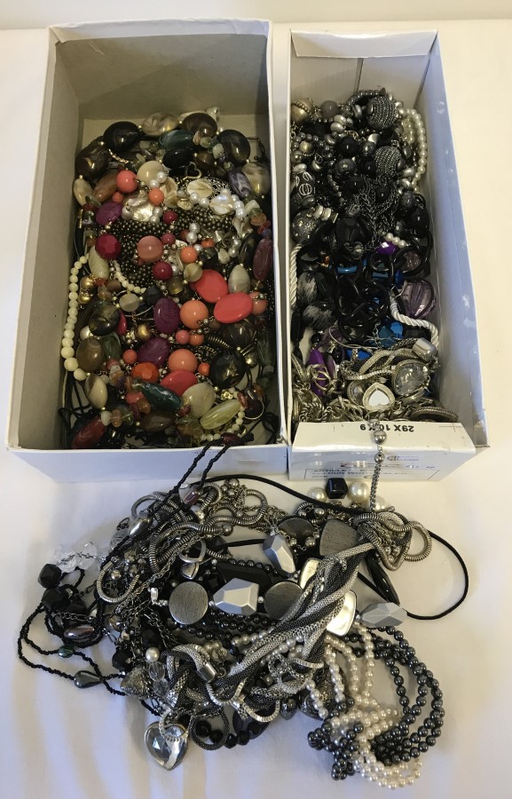 2 boxes of costume jewellery items.