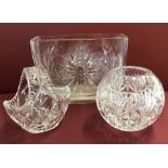 3 crystal items; A large rectangular vase, a basket and a spherical vase.