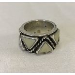 A heavy hallmarked silver ring with triangle design.