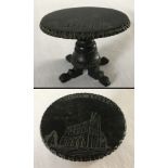 A Victorian carved Whitby Jet miniature occasional table.