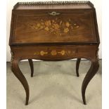 A Late Victorian walnut veneered French Louis XV style inlaid bureau.