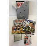 A collection of 007 James Bond magazine with collectors cards.