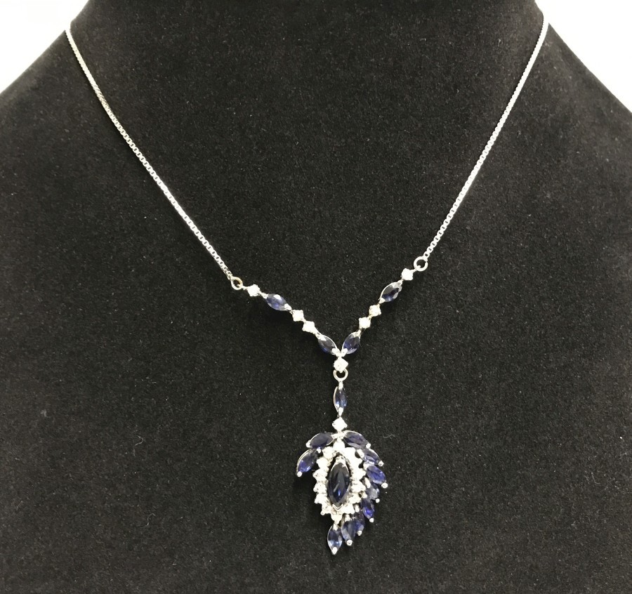 An 18ct white gold, blue & white sapphire pendant on 14ct gold chain.