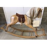 A Relko wooden rocking horse.