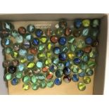 A box of vintage glass marbles.