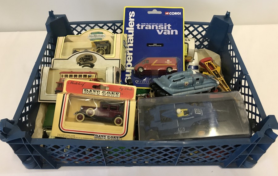 A box of boxed & unboxed diecast and Scalextric car.