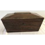 A vintage wooden coffin shaped tea caddy.