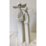 A Lladro figurine #4611 Two Nuns.