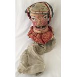 An antique fairground Aunt Sally head.