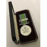 A cased Battle For Britain commemorative medal with the army clasp.