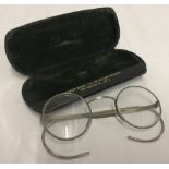 A pair of cased WWII gas mask eyeglasses.