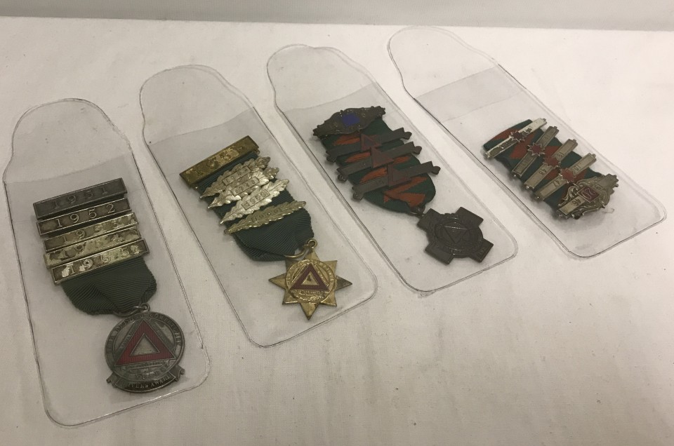 A collection of safe driving competition medals. 1940's - 60's.