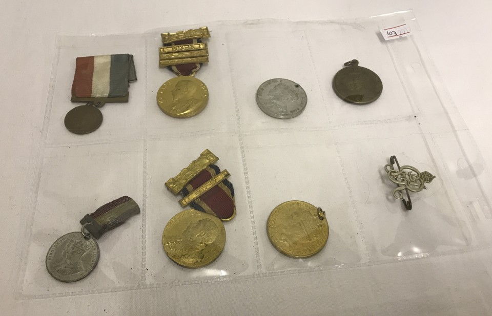 A collection of 8 George V and George VI coronation medals and badge.