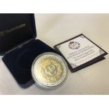 A limited edition cased William & Catherine Engagement Silver Proof coin with selective gold ink.