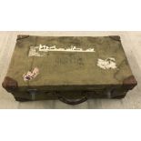 A canvas and leather demob suitcase dated 1943.