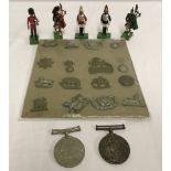 A small quantity of assorted military related items.