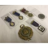 A collection of masonic jewels and badges.