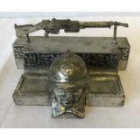 A French Art Deco style pewter inkwell, the well being the head of a French Infantry soldier.