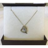 A 9ct gold floating heart pendant with diamond set butterfly detail on 9ct gold chain.