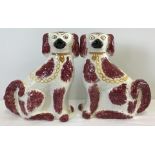 A pair of large Staffordshire flat back ceramic fire dogs.