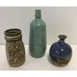 2 small studio pottery vases together with a mottled green glass bottle.