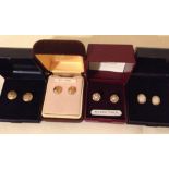 4 boxed pairs of 9ct gold stud earrings.