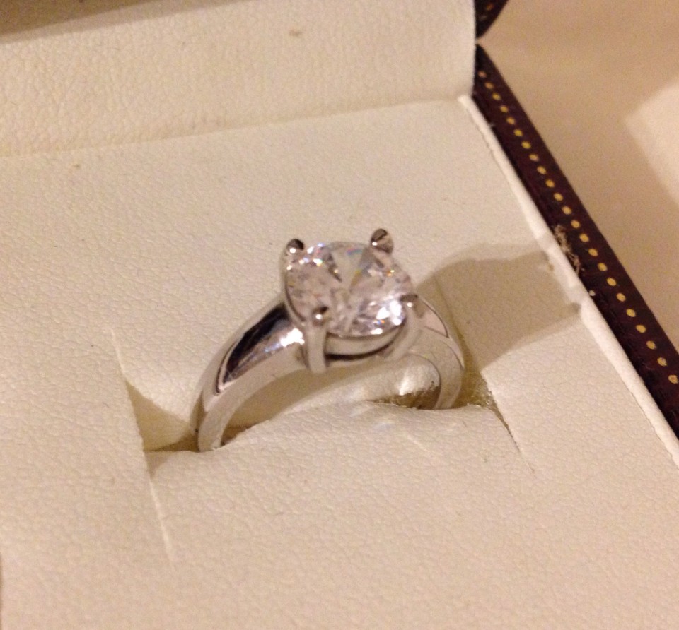 A hallmarked silver ring set with a large cubic zirconia.