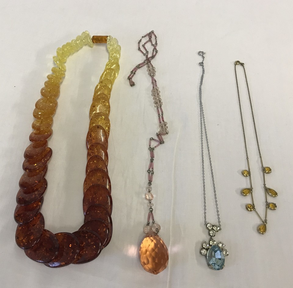 4 costume jewellery necklaces.