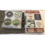A collection of vintage beer mats.