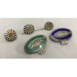2 hallmarked silver badges with coloured enamel outers, marked Canning 20.