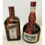 A 70cl bottle of Cointreau together with a 70cl bottle of Grand Marnier liqueur.