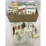 A box containing a large quantity of vintage dress patterns dating back to c.1940's.