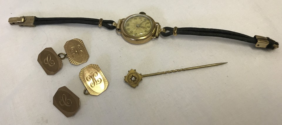 A Victorian gold stick pin, a ladies vintage 9ct gold cased watch, and 9ct gold cufflinks (a/f).