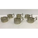 Irish Police interest - A set of 6 silver coffee can holders with serpent handles.